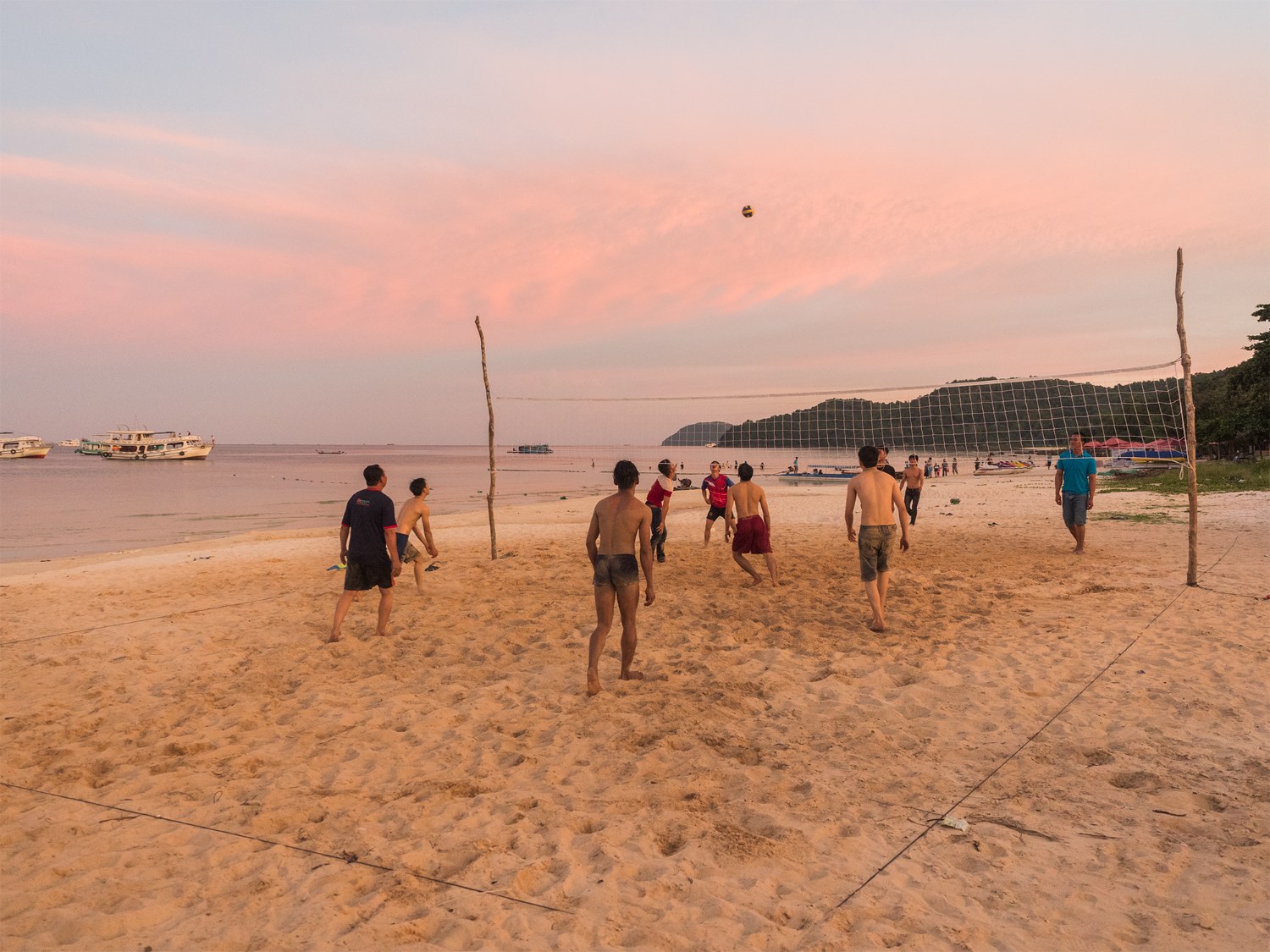 Beach volleyball at golden hour
