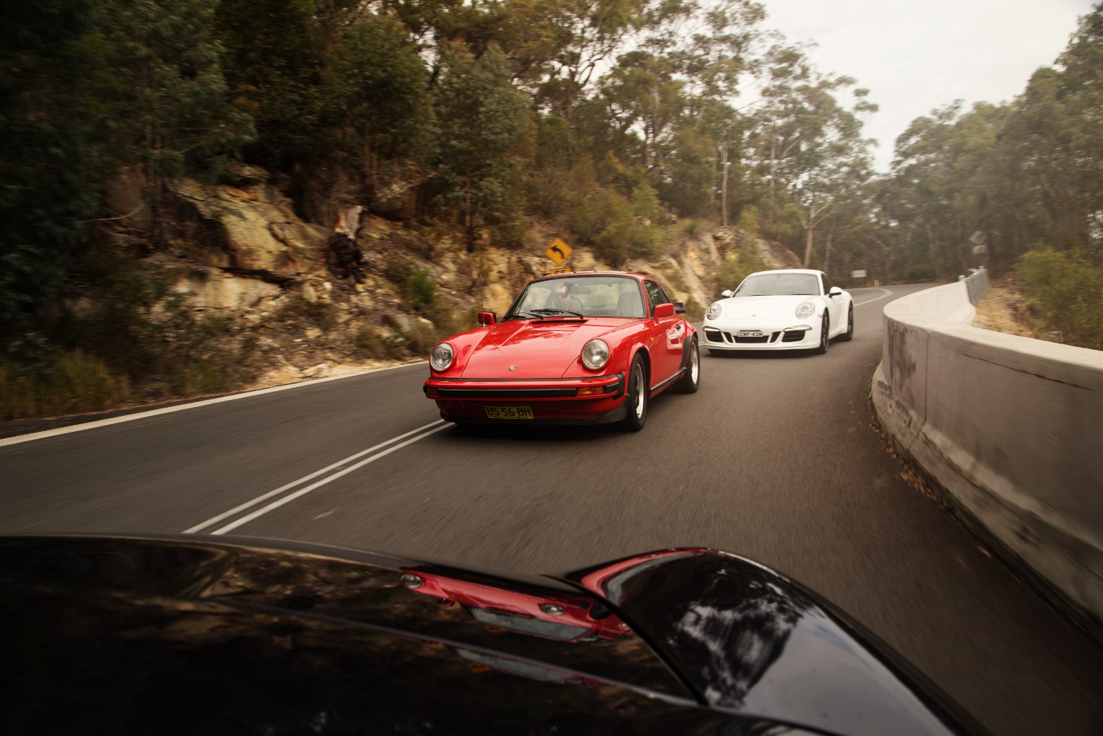 Automotive photography — Porsche 911s on a coastal road